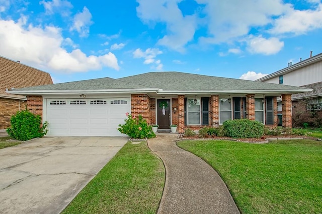 ranch-style house featuring a garage and a front yard