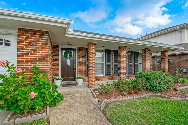 property entrance featuring a garage and a porch