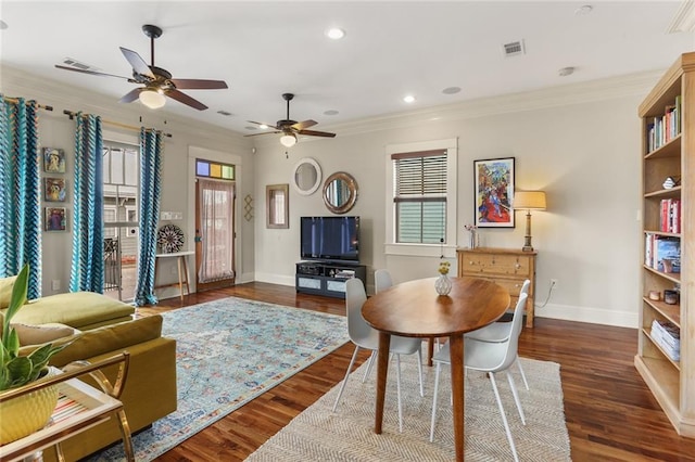 living room featuring dark hardwood / wood-style floors, ceiling fan, and crown molding