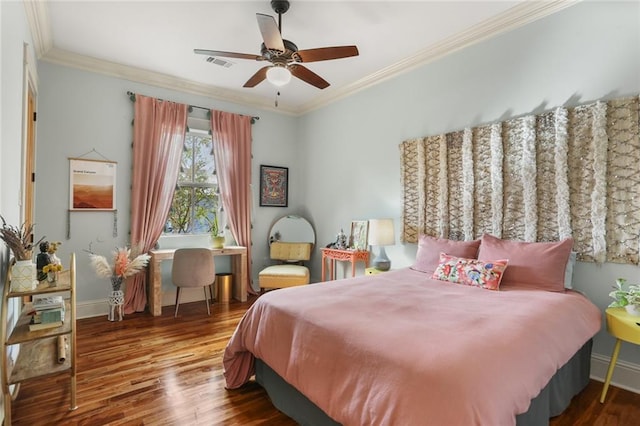 bedroom with ceiling fan, dark hardwood / wood-style flooring, and ornamental molding