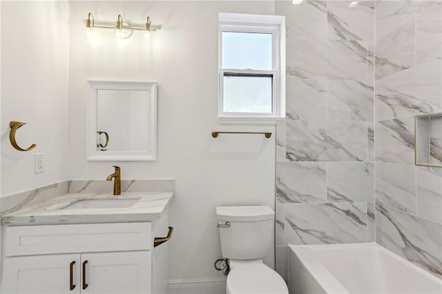 full bathroom featuring toilet, vanity, and tiled shower / bath