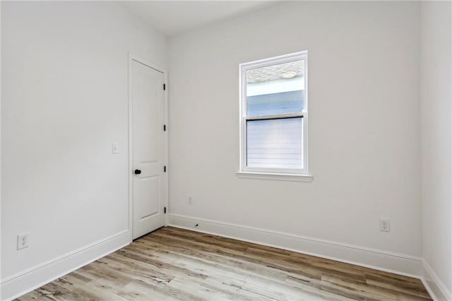 spare room featuring light wood-type flooring