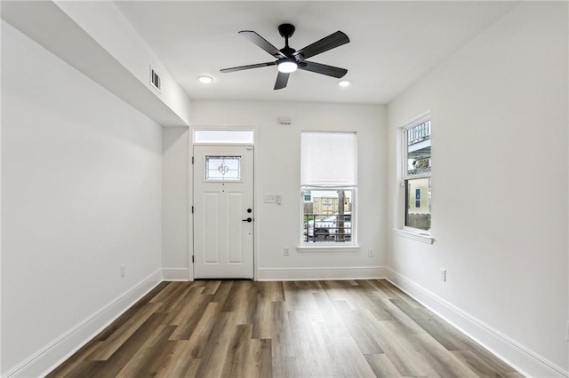 entrance foyer with dark hardwood / wood-style flooring and ceiling fan