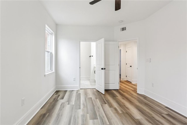 unfurnished bedroom featuring light hardwood / wood-style flooring and ceiling fan