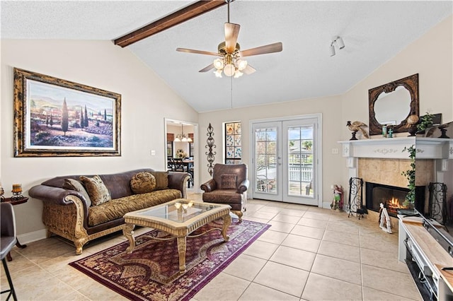 living room with french doors, vaulted ceiling with beams, a fireplace, light tile patterned floors, and ceiling fan