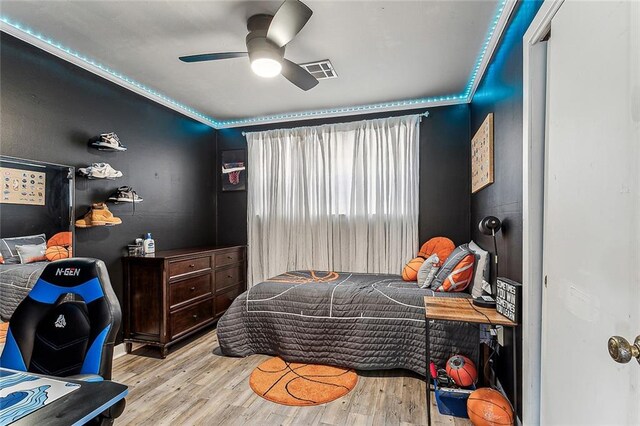 bedroom featuring ceiling fan and light hardwood / wood-style floors