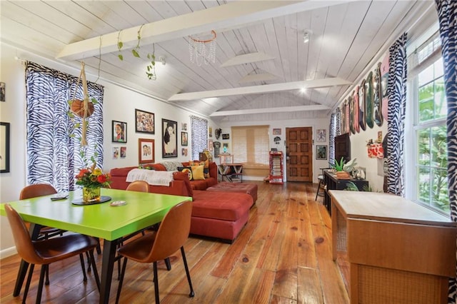 dining area featuring wooden ceiling, light wood-type flooring, and lofted ceiling with beams