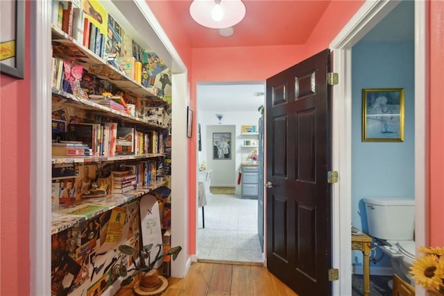 hall with light hardwood / wood-style flooring