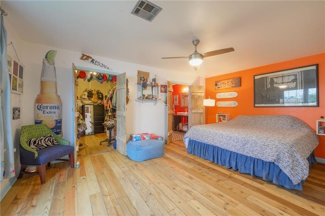 bedroom featuring wood-type flooring and ceiling fan