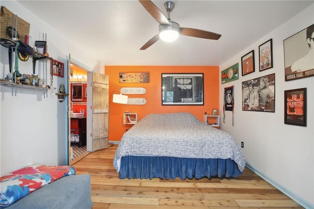 bedroom featuring light wood-type flooring and ceiling fan