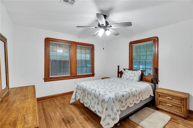 bedroom with light wood-type flooring and ceiling fan