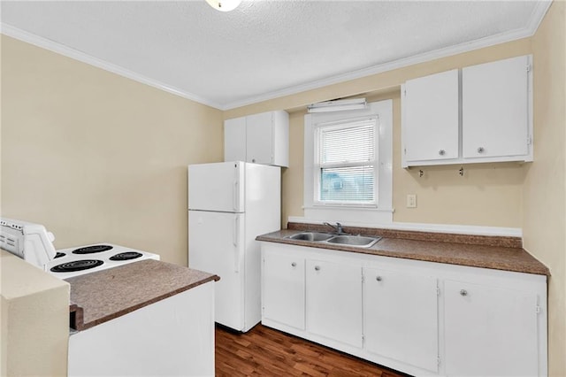 kitchen with white cabinetry, sink, white appliances, and dark hardwood / wood-style floors