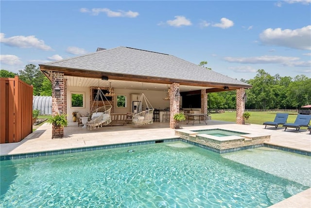 view of swimming pool featuring a gazebo, an in ground hot tub, and a patio area