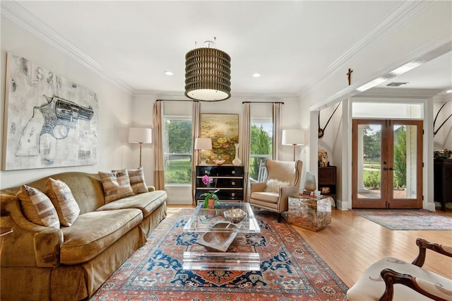 living room featuring ornamental molding, french doors, and wood-type flooring