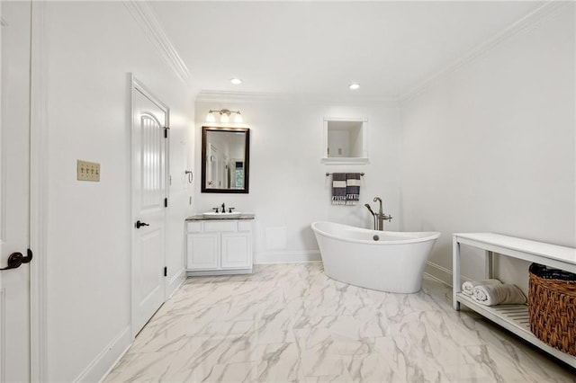 bathroom featuring vanity, ornamental molding, and a bathing tub