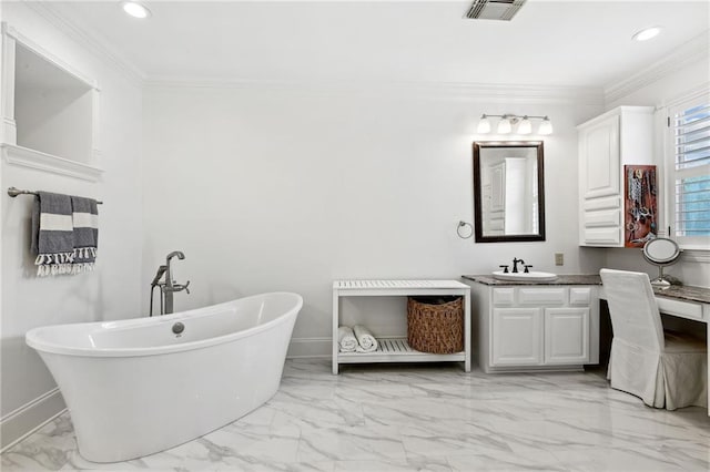 bathroom featuring ornamental molding, vanity, and a tub to relax in