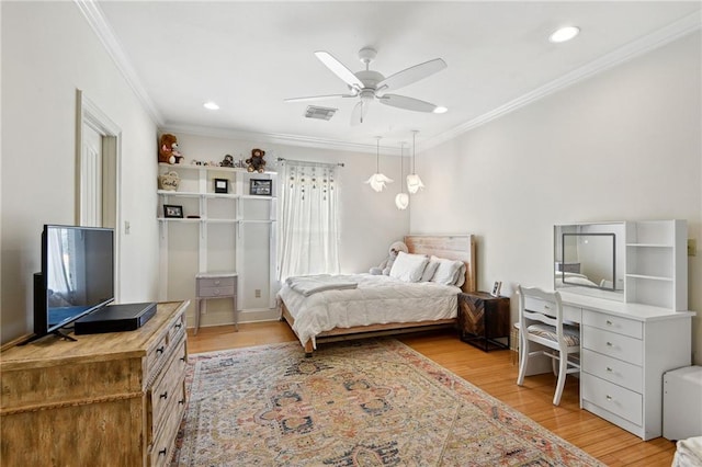 bedroom with ceiling fan, light hardwood / wood-style flooring, and ornamental molding