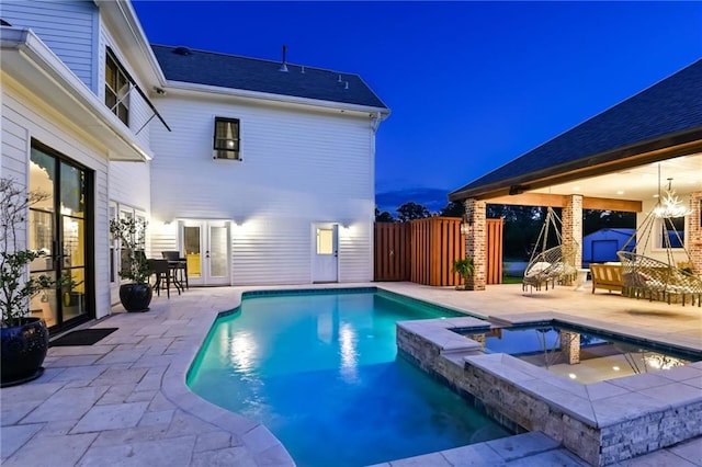 view of pool featuring an in ground hot tub and a patio area