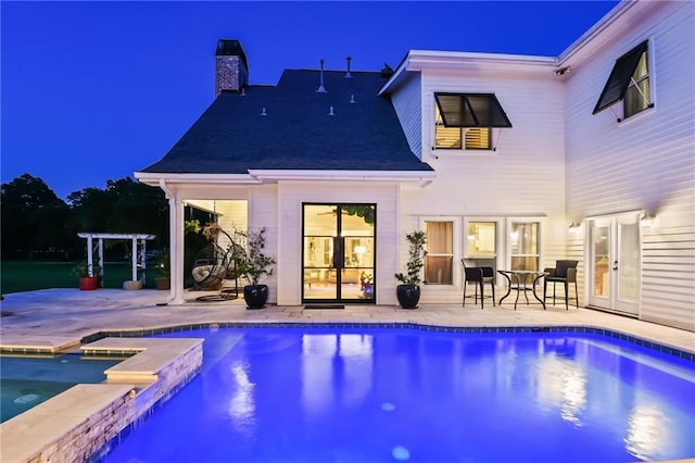 view of swimming pool with an in ground hot tub and a patio area