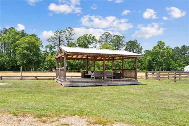 view of community with a lawn, a gazebo, and a deck