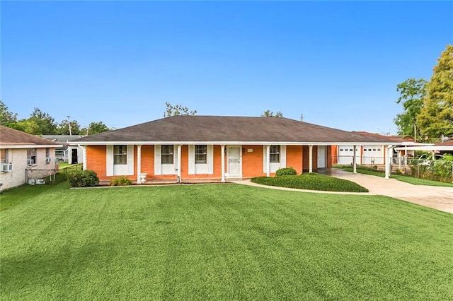 ranch-style home featuring a garage, a front yard, and covered porch