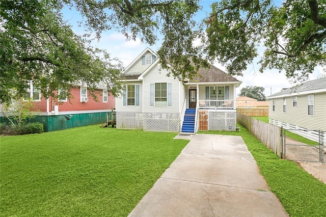 view of front facade featuring a front lawn and covered porch