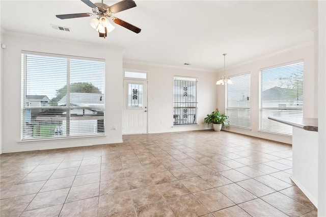 interior space with ceiling fan with notable chandelier, a healthy amount of sunlight, and crown molding