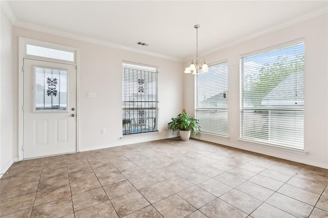 unfurnished dining area with ornamental molding, a chandelier, and light tile patterned flooring