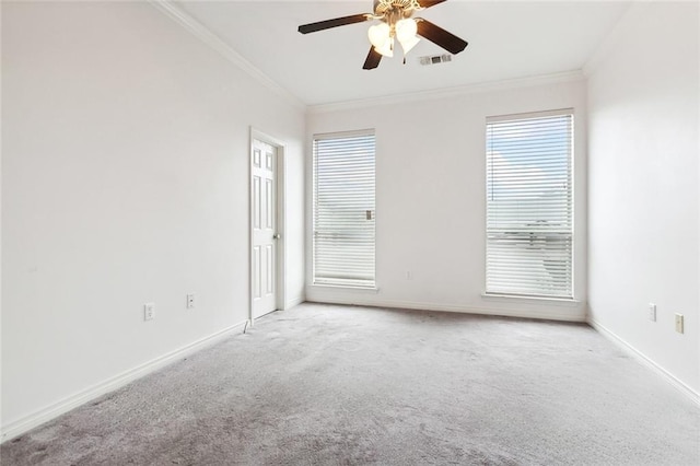 empty room with light colored carpet, ceiling fan, and crown molding