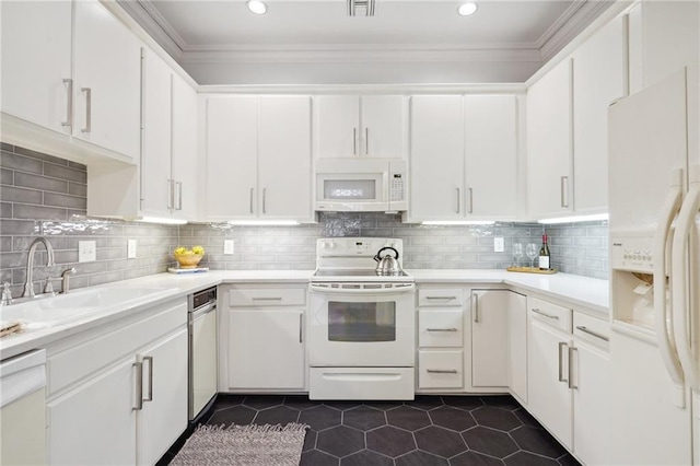 kitchen featuring white cabinetry, white appliances, and sink