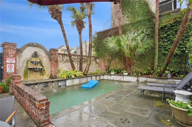 view of swimming pool featuring a patio