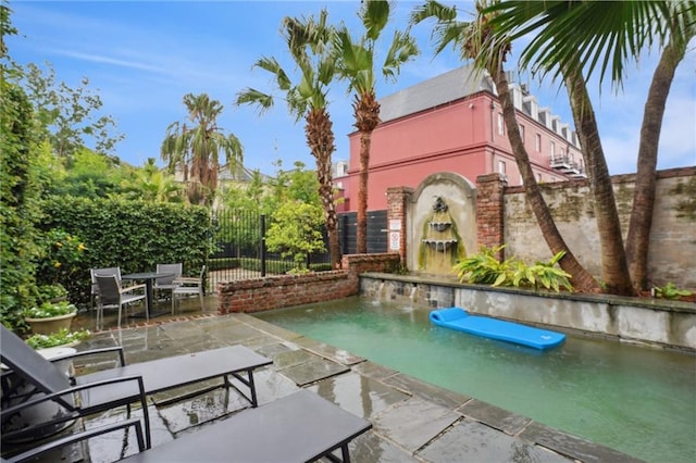 view of swimming pool featuring a patio