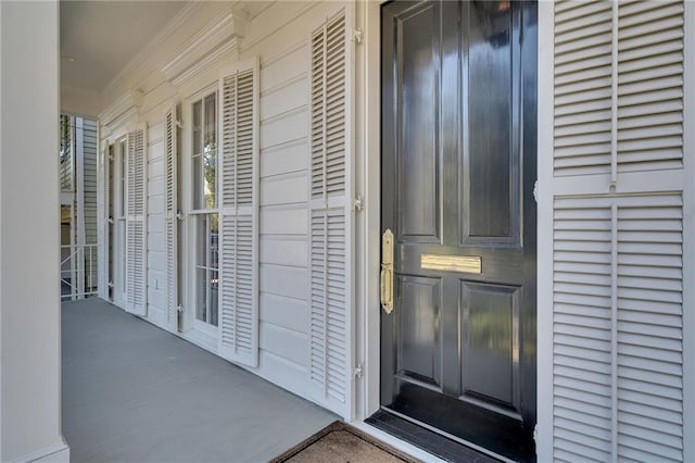 doorway to property featuring covered porch