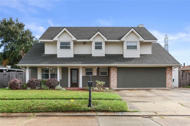 view of front of house featuring a garage and a front yard