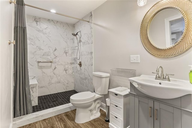 bathroom featuring toilet, a shower with curtain, vanity, and wood-type flooring