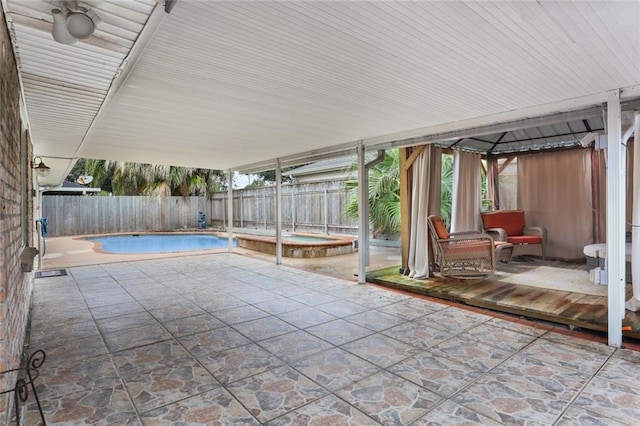 view of pool with an in ground hot tub and a patio area