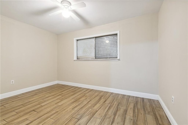 empty room featuring ceiling fan and light hardwood / wood-style flooring