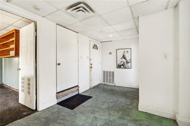 4210 Murano Rd, New Orleans, LA 70129 - interior space featuring a paneled ceiling, concrete floors, and baseboards