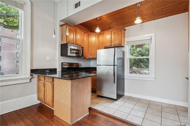 kitchen with stainless steel appliances, kitchen peninsula, hanging light fixtures, wooden ceiling, and light wood-type flooring