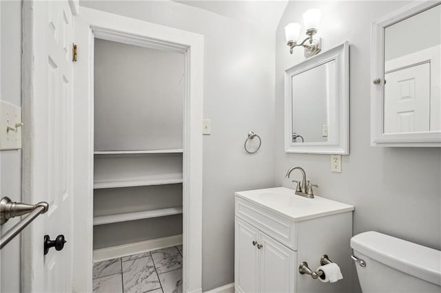 bathroom featuring toilet and vanity