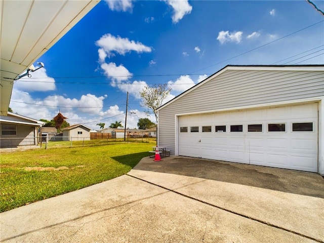 garage featuring a lawn