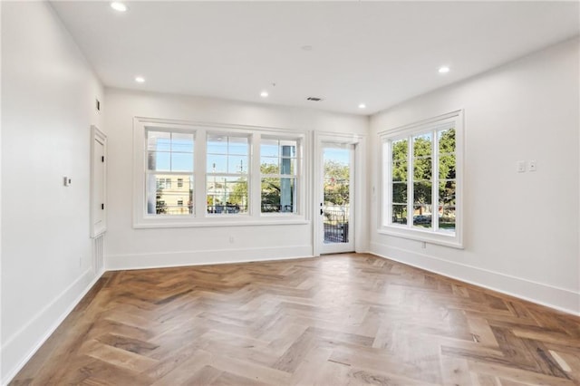 spare room with parquet flooring