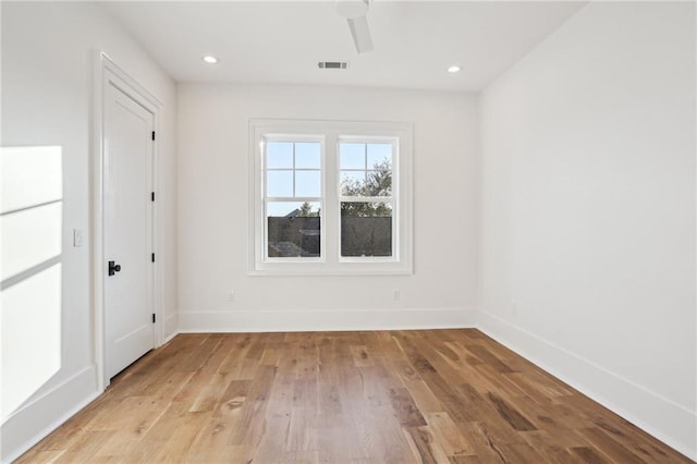 unfurnished room featuring ceiling fan and light wood-type flooring