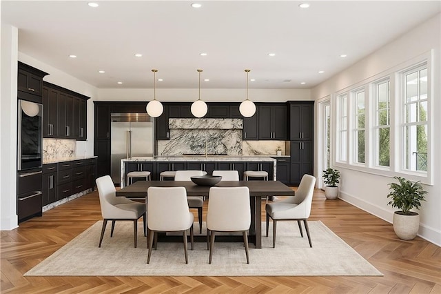 dining area with recessed lighting and baseboards