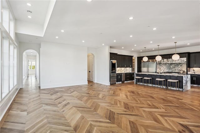 unfurnished living room featuring light parquet flooring