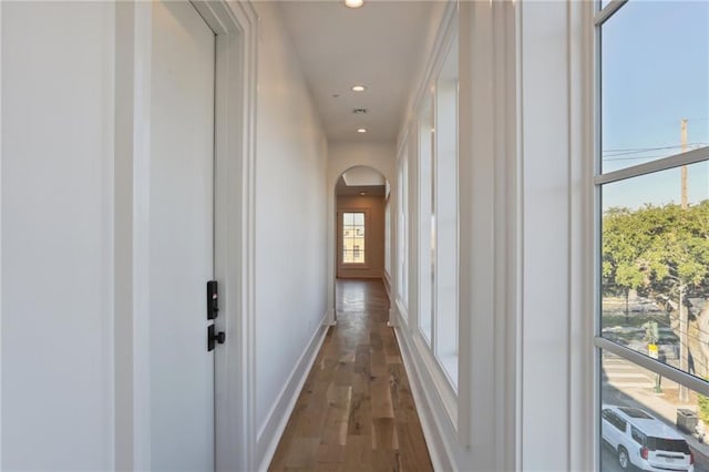 corridor featuring dark wood-type flooring