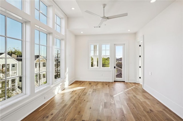 doorway with ceiling fan, recessed lighting, baseboards, wood finished floors, and visible vents
