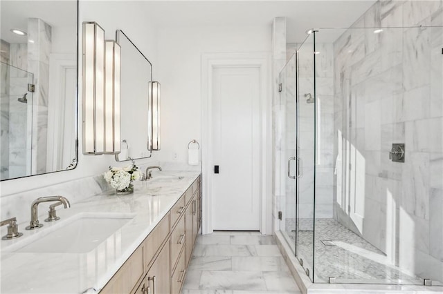 bathroom featuring an enclosed shower and vanity