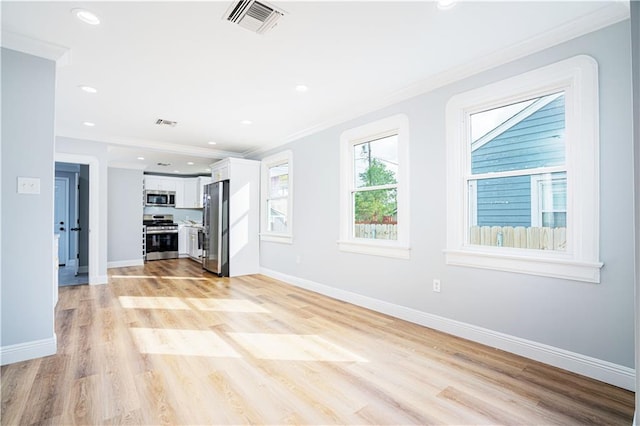 unfurnished living room featuring light hardwood / wood-style flooring and crown molding