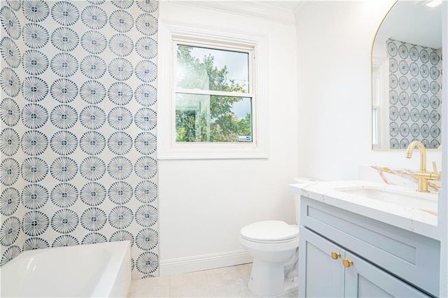 bathroom featuring toilet, tile patterned flooring, a washtub, vanity, and crown molding